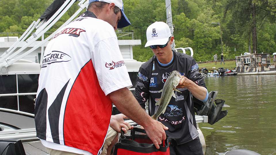 Alabama angler Sam George bags up his catch.