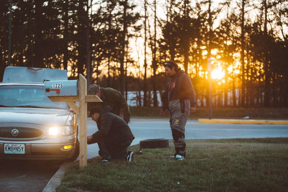 While refueling for Day 2, Robert Nakatomi and photographer Tanner Yeagar assist an elderly man with a flat tire. 