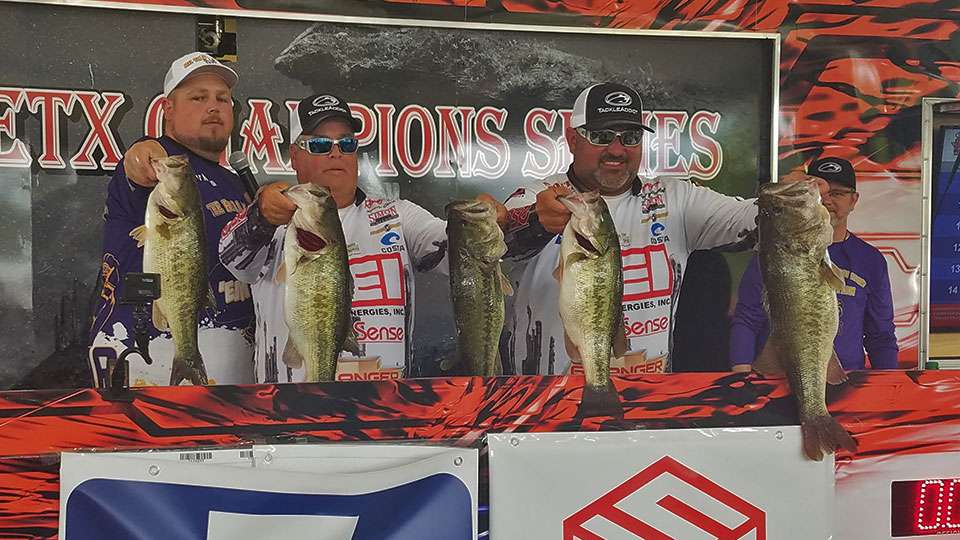 Locals Cory Rambo and Rusty Clark won the open tournament with a 31-pound limit. That's emcee Fat Cat Newton helping them hold 'em up.