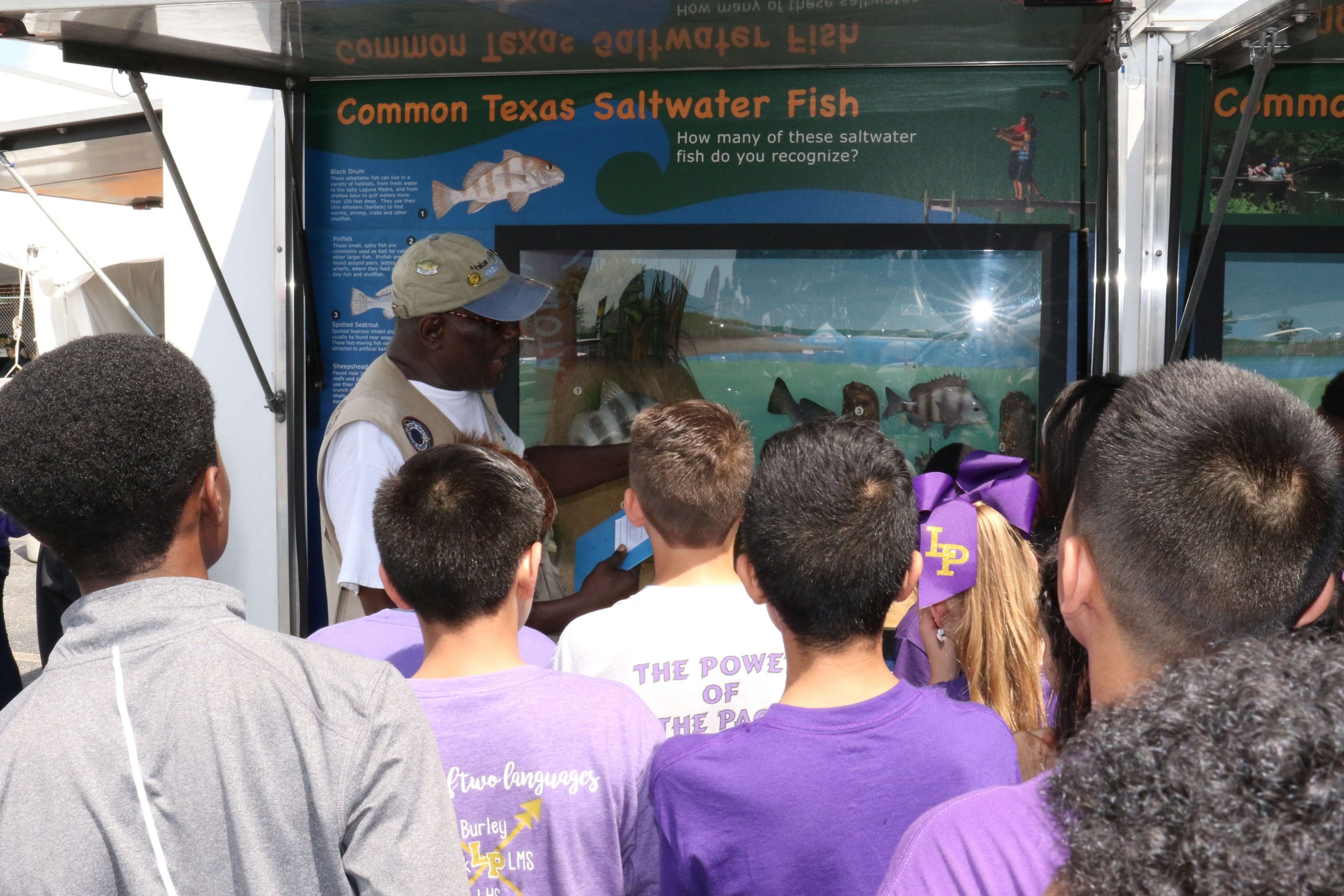More learning is going on at the Texas Parks and Wildlife kiosk about fish identification. These students are from Lufkin Middle School. 