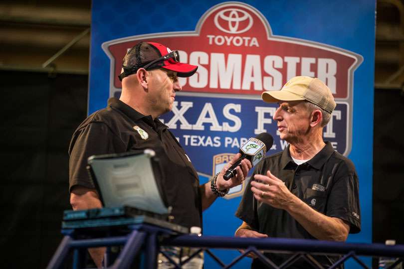 Emcee Dave Mercer chats with Tournament Director Trip Weldon before weighing in the first angler on Day 1 of the Toyota Bassmaster Texas Fest benefiting Texas Parks and Wildlife Department.
