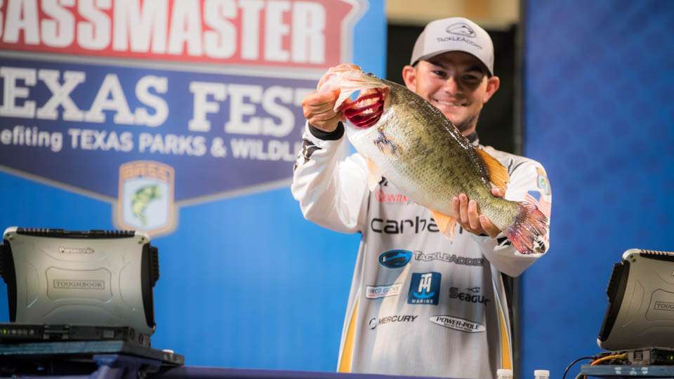 Jordan Lee, who rallied on the final day to win the Classic, tried again. He shows off a fish over 21 inches long, a requirement to bring one to the stage.