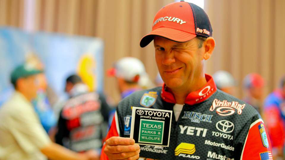 Kevin VanDam finished third in that tournament and is shown here displaying the decal that will be displayed on the windshield of every competitors boat this week. 