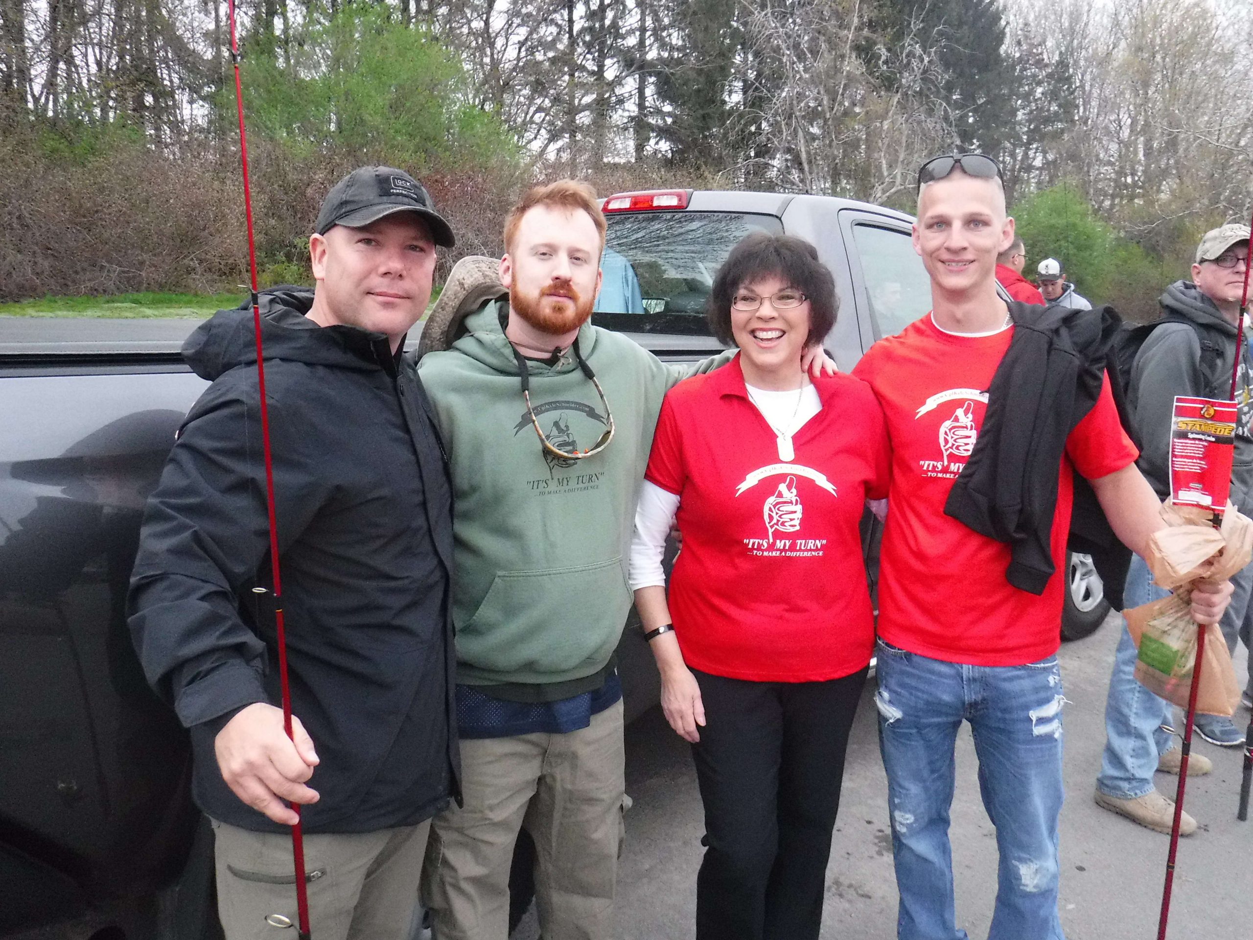 Marines- Brandon, Andrew, and Neil pose with Laurie Schneider, mother of Cpl. Kyle Schneider.
