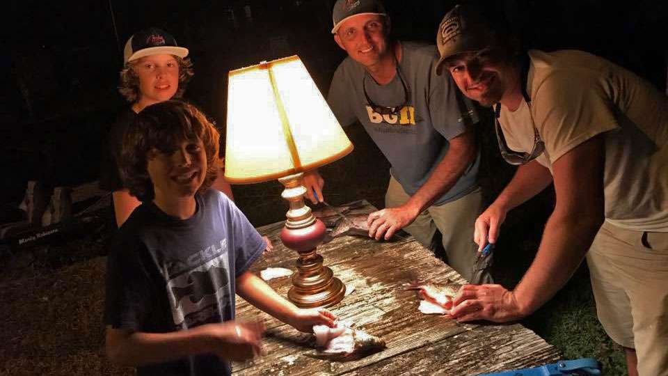 Marty Robinson and his crew clean fish by lamplight. âAwesome first weekend at our little St John's River retreat! Lots of remodeling and a little fishing of course!!â