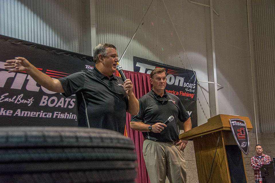 Triton Pro Staff and Ultimate Bass Radio's Kent Brown was on hand emceeing the event.  He's pictured here calling out names for door prizes with Adam.

