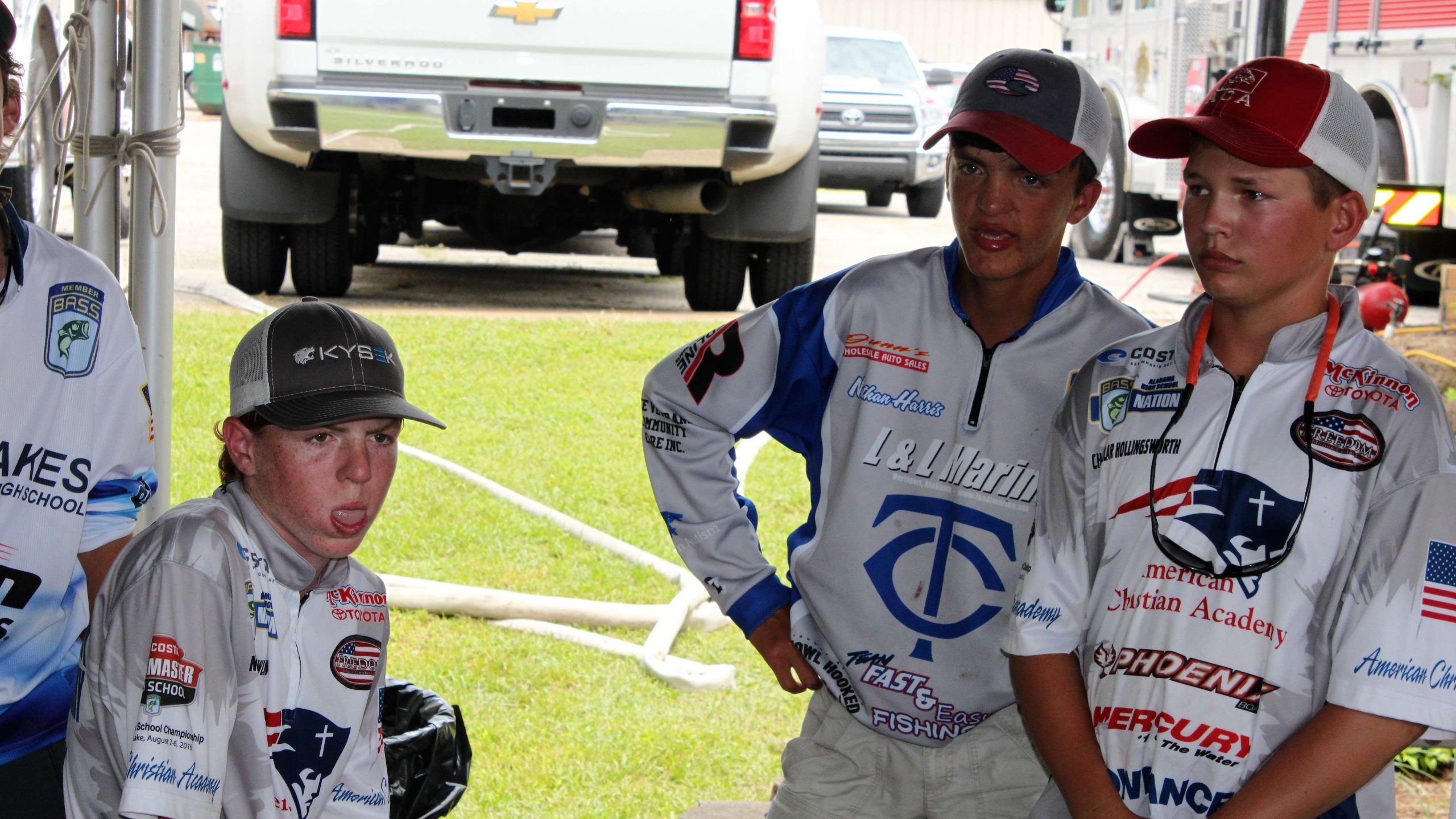 Miller Dowling, left, and Chandlar Hollingsworth, right, knew they had a heavy limit of fish on Day 2 of the Costa Bassmaster Junior Championship presented by DICKâS Sporting Goods. But waiting backstage, or in the hot seat as they would learn, can be a tedious task. The anglers from American Christian Academy in Tuscaloosa, Alabama waited patiently before the weigh-in to see how they would fare. Pictured, center, is Nathan Harris of the Tuscaloosa County Bassmasters Club.