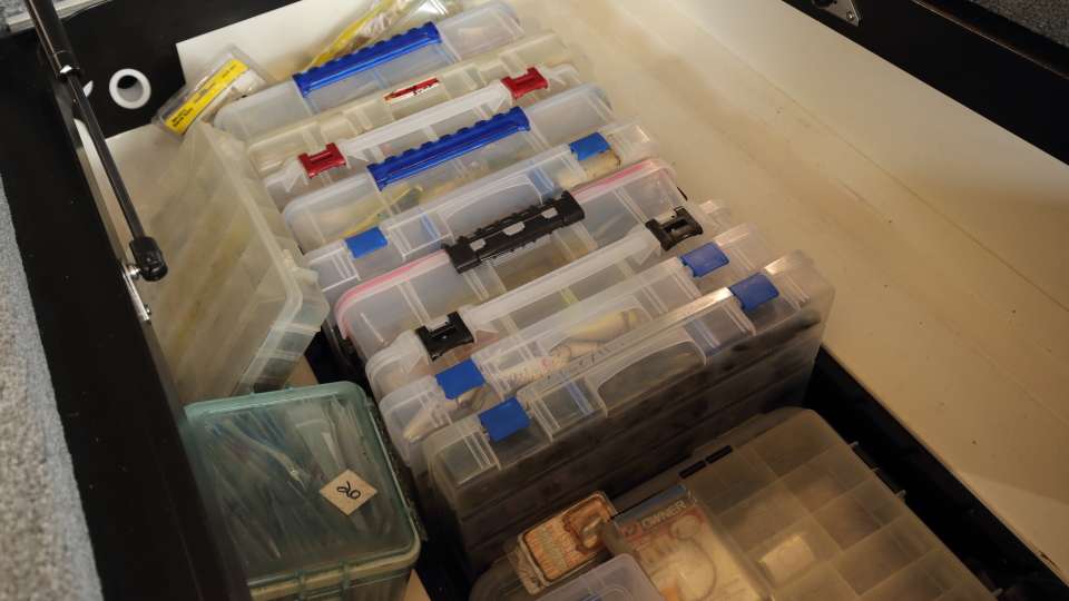 Jordon's many tackle boxes line up nicely in the center compartment. 