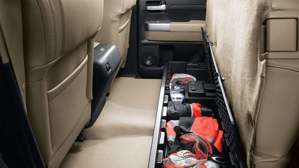 The Tundra is designed to haul big loads, but sometimes you need to take extra care of small items that canât ride loose in the bed. This covered storage compartment tucks neatly under the rear seats and secures your things, while keeping them safe from prying eyes.