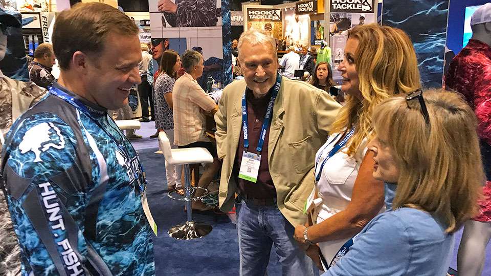 Jerry McKinnis, Angie Thompson and Teresa Wilson Lux share a smile with a Mossy Oak worker after it was announced that Elements became the official pattern of B.A.S.S. 