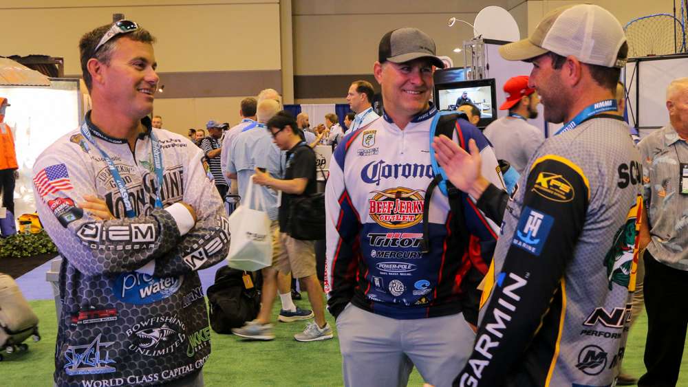 Elite pros Tyler Carriere and Brandon Coulter stop to speak with friend Casey Scanlon.