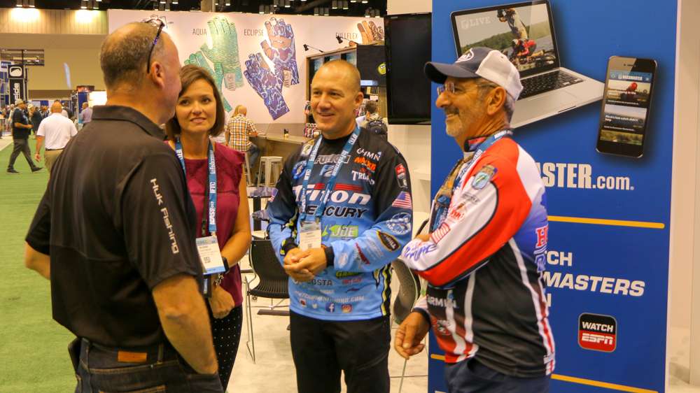 Brent Chapman and Paul Elias stop by the Bassmaster booth to talk some business.