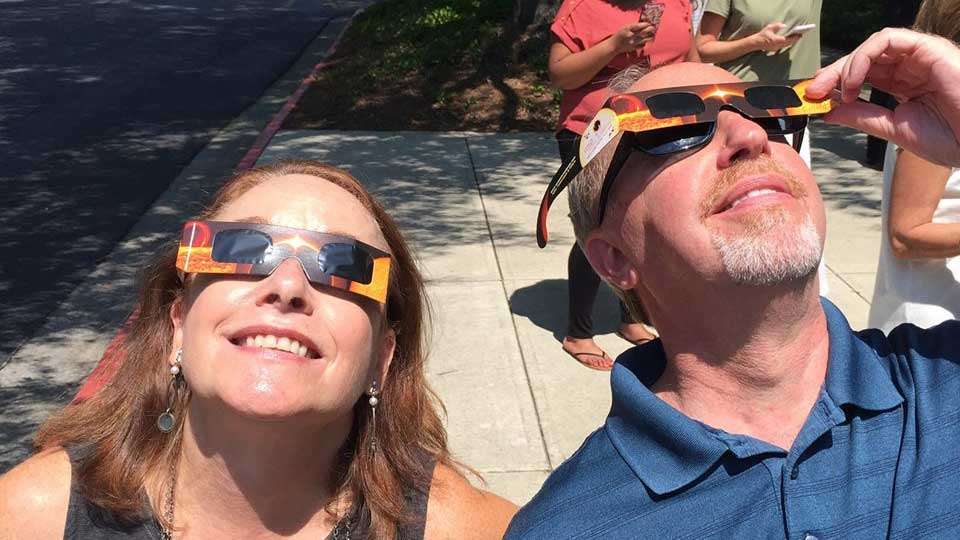 Faith McDonough and Mitch Frank of B.A.S.S. look up to the skies for at the eclipse. (This was hours after the moon's shadow had passed. Don't tell them.)