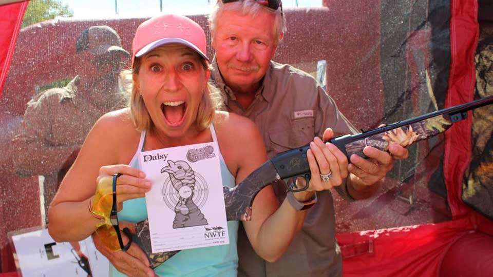 Becky is pretty excited she did well with the BB gun.
