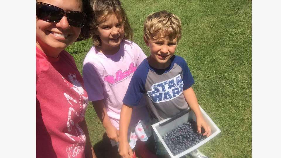 Julie Kennedy, Sophia and SJ are not feeling blue, just picking âem. The blueberries in the North Country are ripe and ready.