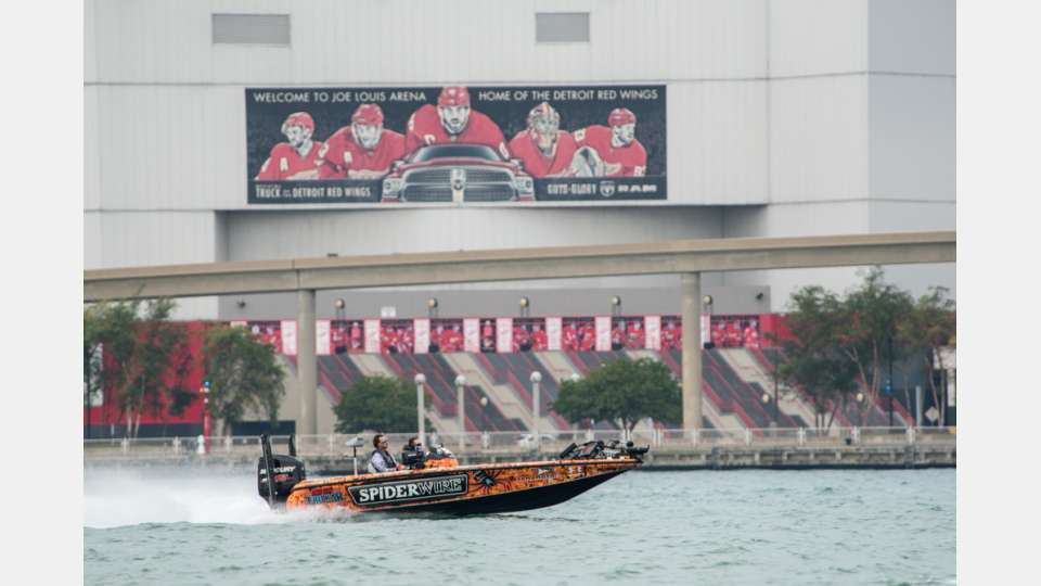 Downtown Detroit, where concrete shoreline bounces waves like a washing machine, is considered one of the worse sections to run in a bass boat. Here Fletcher Shryock cruises past Joe Louis Arena, home of the Detroit Red Wings.