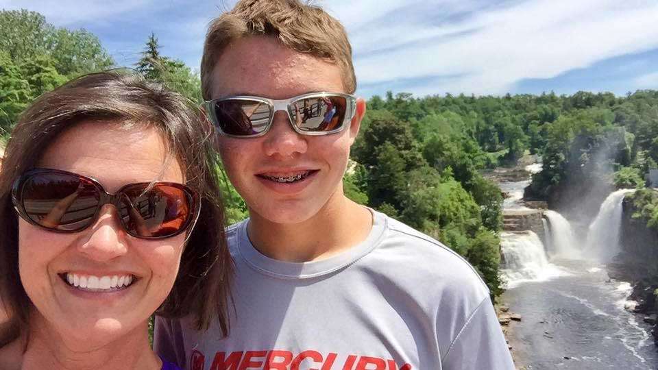 Bobbi and Mason take a selfie with an amazing view of Ausable Chasm in the background.