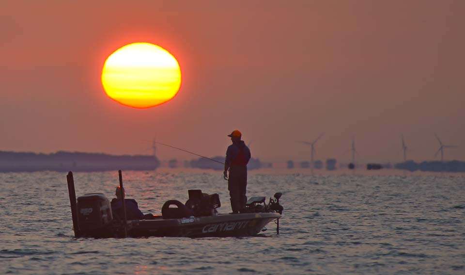 The morning sun shines as Matt Lee gets to work on Day 3 of the 2017 Advance Auto Parts Bassmaster Elite at Lake St. Clair. 