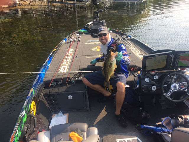 After a slow stretch, this largemouth bit and almost broke off on a propeller by a dock. Ott says with the day he's having so far, he's glad he is in a no pressure situation.