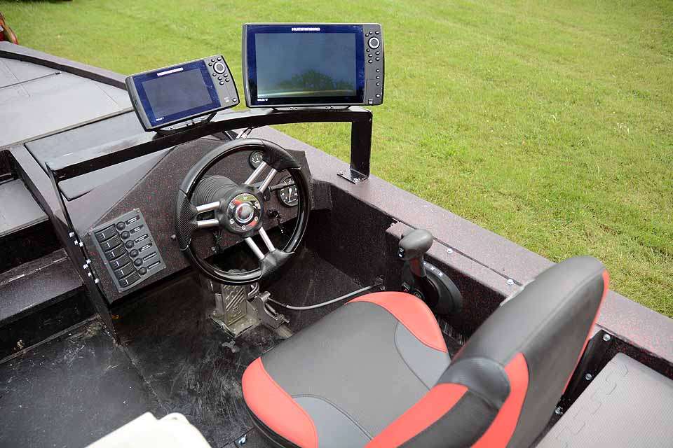 The console layout is simple for a reason. Staying focused ahead while running through inches deep water is a must. For lake fishing he uses Humminbird Helix 7 and Helix 12 units mounted above the dashboard. 