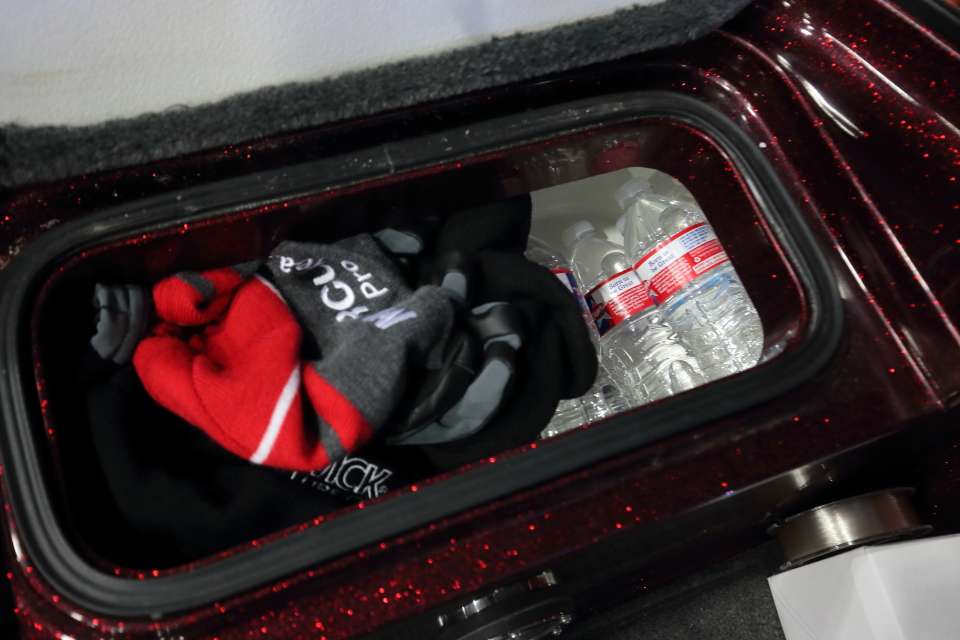 A small storage compartment carries miscellaneous items like bottled water and clothing to help Christie stay warm. 