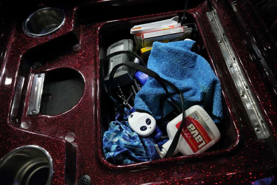 Another small compartment between the seats holds a little bit of everything, including a Power Pole remote, Chapstick, chewing gum, buffs, soap, sunblock and scales. 
