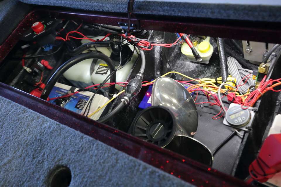 Inside a crowded battery box, Christie carries a spare prop for the outboard and spare props for the trolling motor.