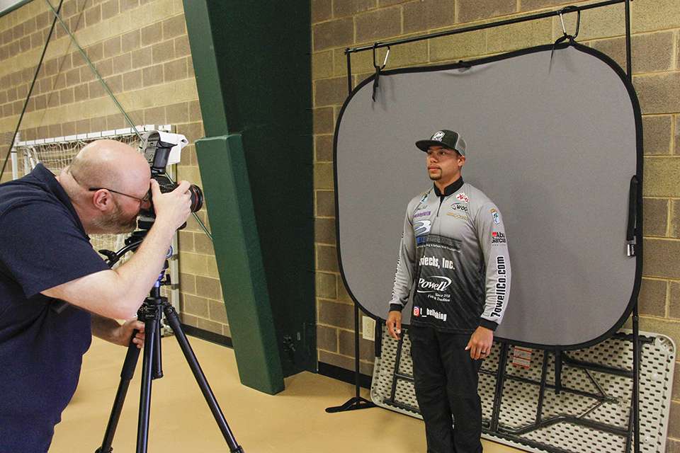 Chris Mitchell takes headshots of every angler that comes through the line.