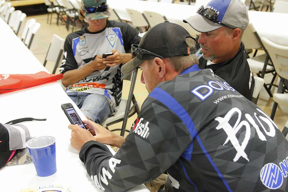 Josh Douglas and Jon Englund look over past Douglas Lake results as they try to gauge how the weights will be this week.