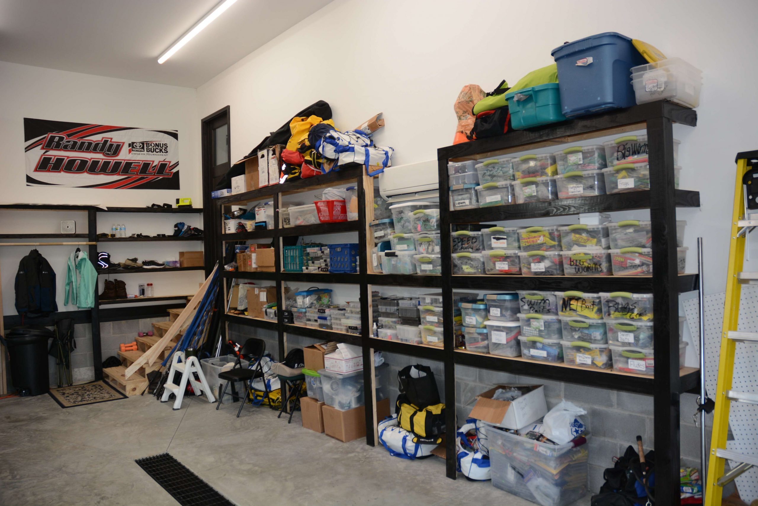 To the right is another wall of shelves that hold all of the lures and related hardware that get rotated in and out of the RV and boat. 
