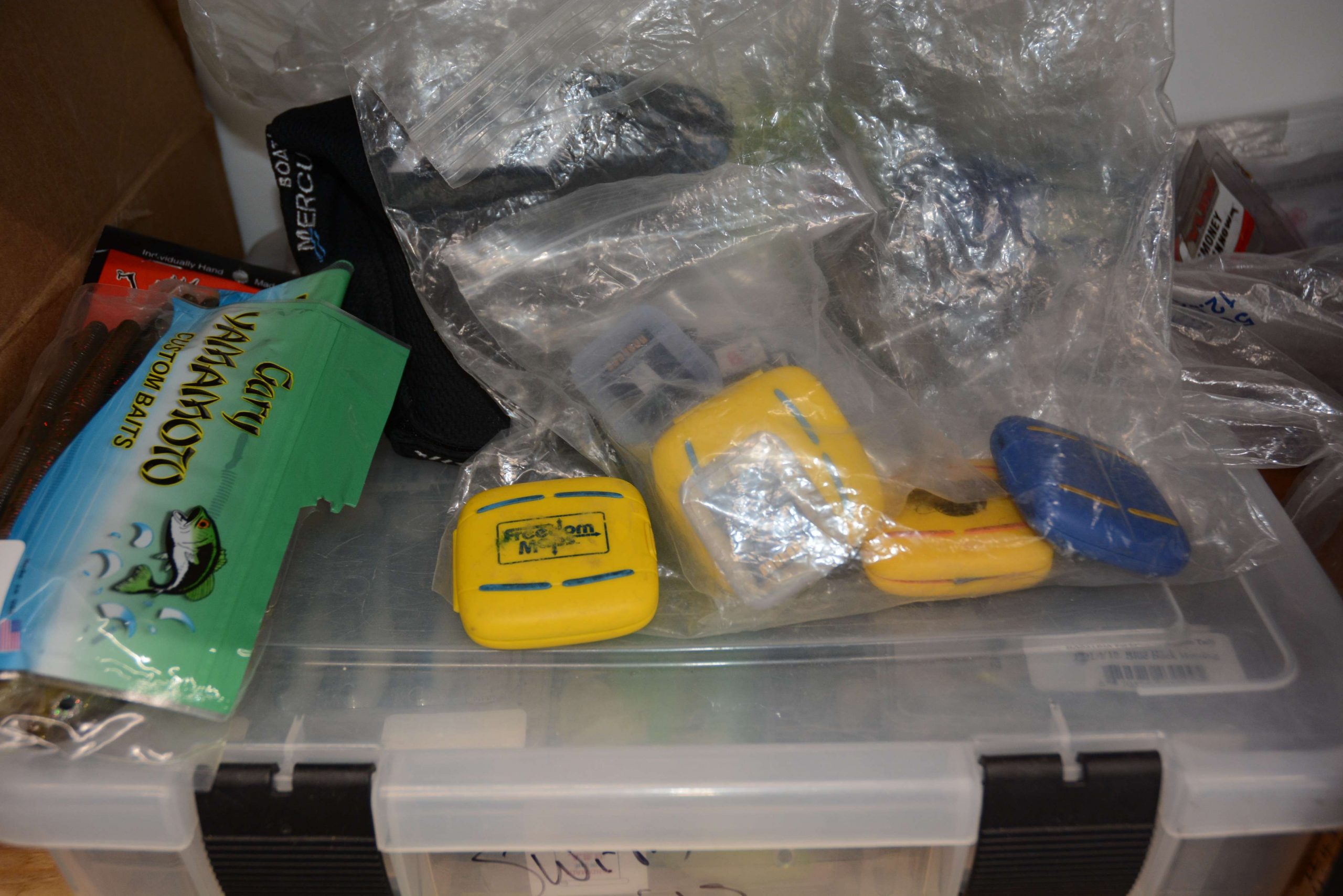 Thereâs a lot of secret intelligence info stored in these zip-close bags. Inside those yellow boxes are map cards for the Lowrance units at bow and dashboard. 