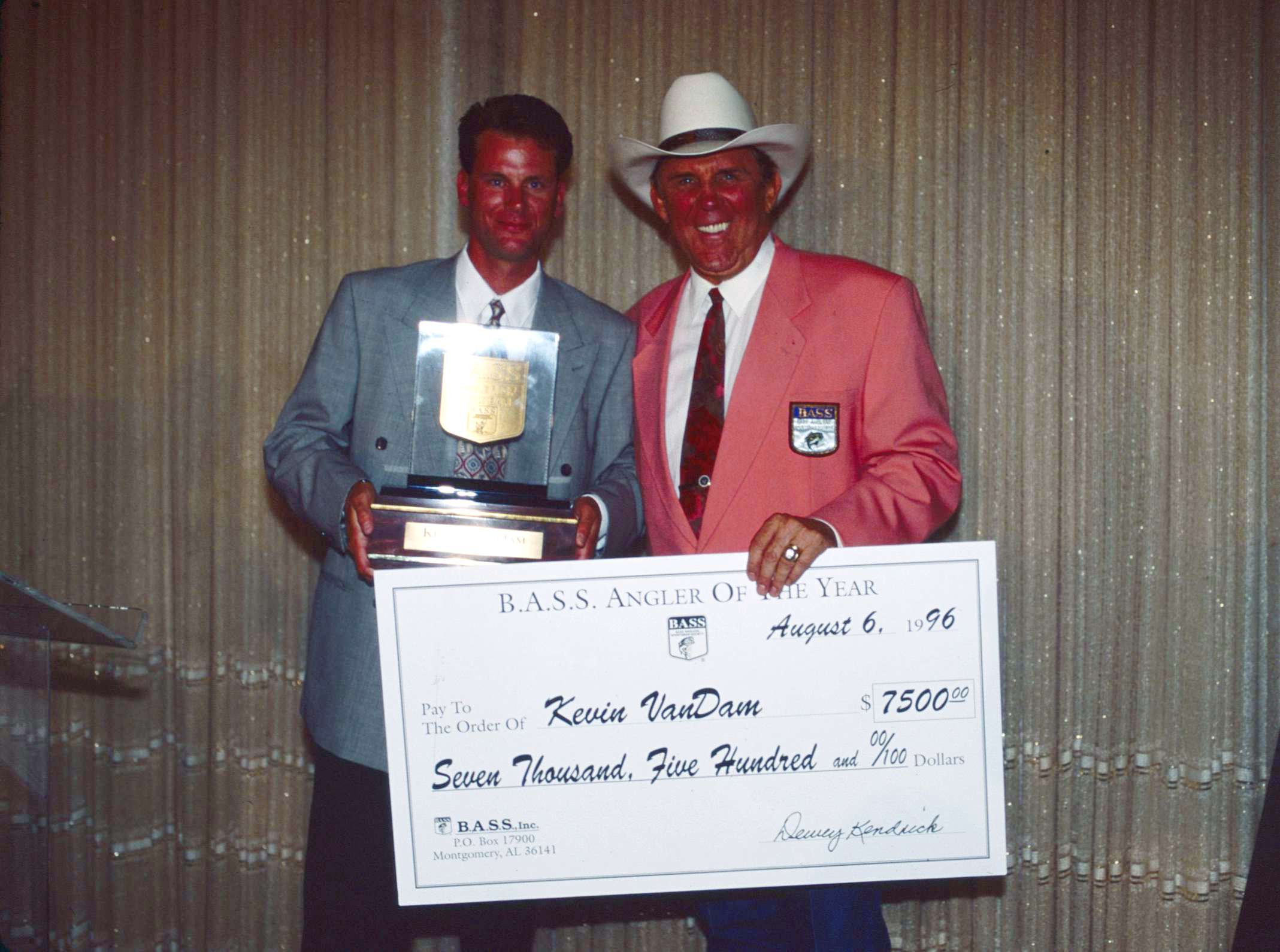 Ray Scott presents Kevin VanDam with his second Angler of the Year trophy in 1996. 