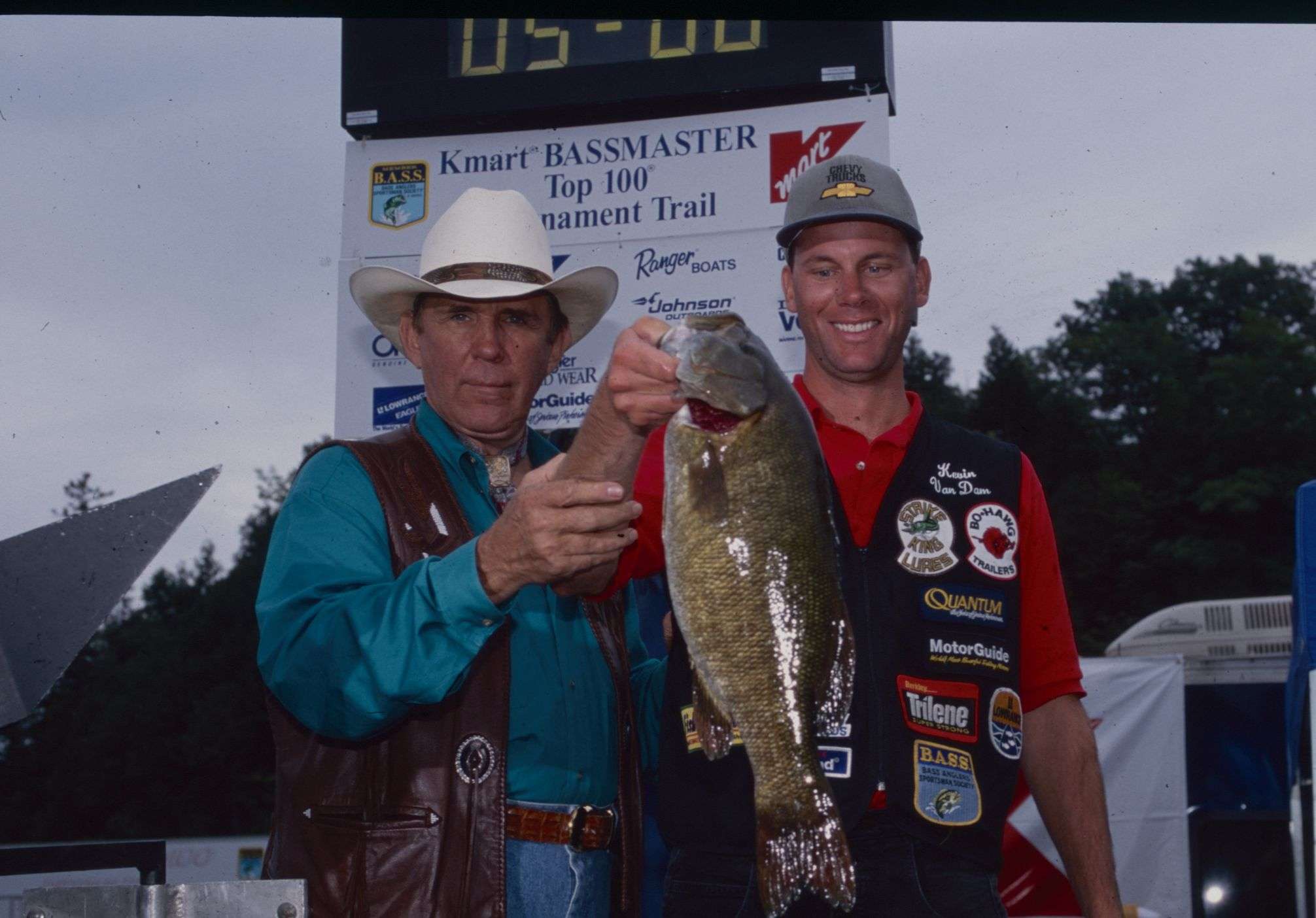 A year after winning his second Angler of the Year title, Kevin VanDam won two tournaments in 1997. Here he and Ray Scott show off a big catch at the 1997 Alabama Bassmaster Top 100. KVD placed 40th at this tournament.