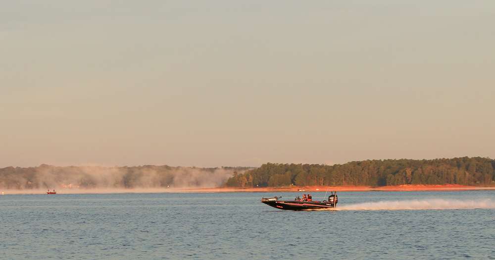 Second place angler, Caleb Sumrall rushed past as the fog lifts.