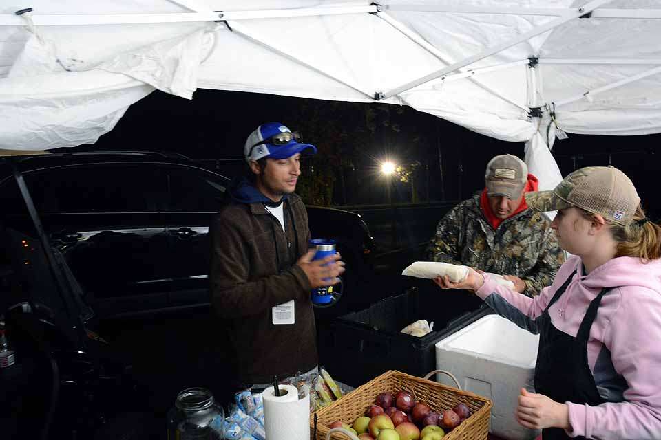 The aroma of breakfast brings the anglers over to the tent to pick up a fresh breakfast.
