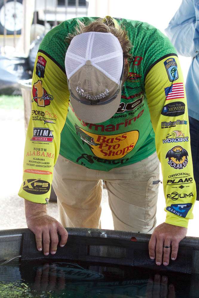 Another top 10 photo, that's Elite angler Tim Horton. It is behind the stage, not a view you get to see very often, but this is an angler flat out exhausted. This is an angler who gave the game every thing he had, thatâs what you want to see in any sport you follow. Become fans of those who play their heart out.