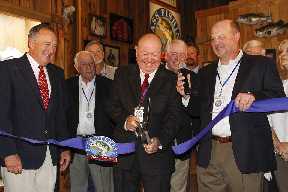 Bill Fletcher, president of the Bass Fishing Hall of Fame board of directors, cuts the ribbon to officially open the facility.