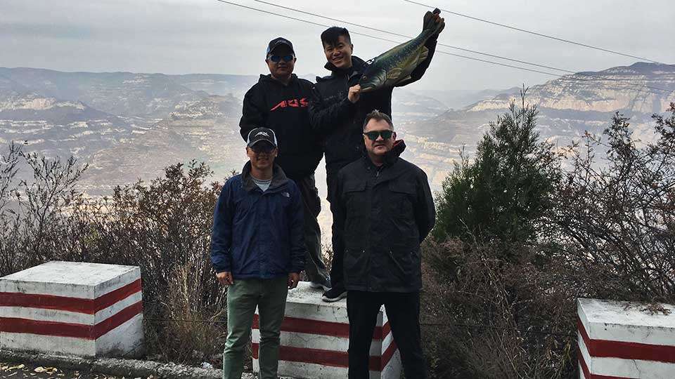 Tharp said these are the people who made his trip happen, and they later told him his visit made a national news report â âAmerican bass pro fishes in China,â or something along those lines. Pictured are Louie, Tommy, Jason and Mark.
