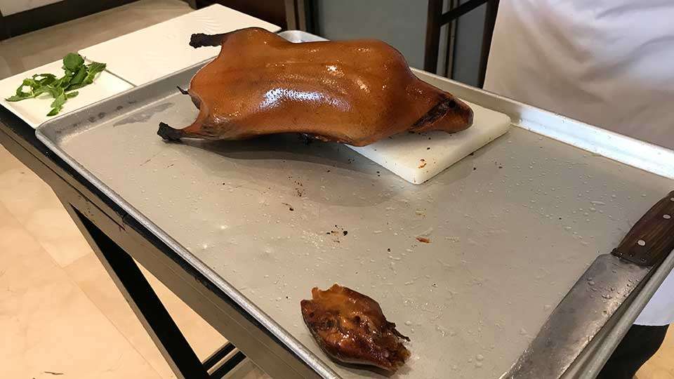 Not a scene out of <em>A Christmas Story</em>, this roasted duck was welcomed when compared to mystery parts in soup. Yes, that is its head. âI thought it was delicious and one of the best mealsâ Randall said.