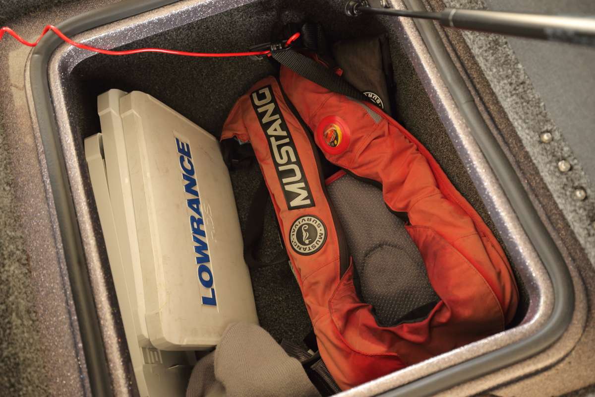 The box behind the driver's seat holds two life jackets, the Lowrance cases and often a toboggan or an extra hat.
