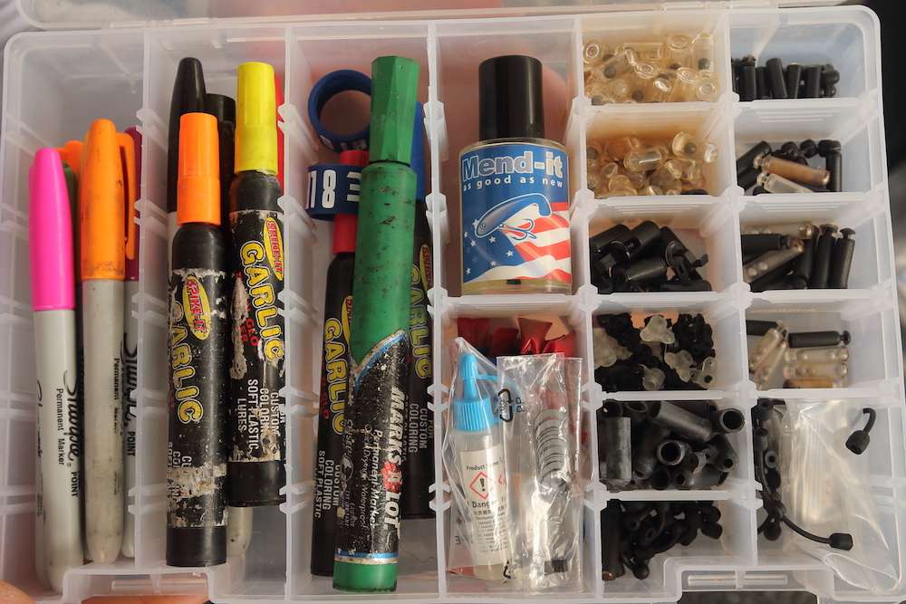 This almost looks like an artist's box with Sharpies, glues, dyes, rattles and more.