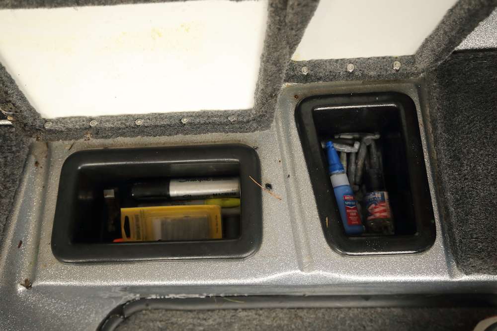 In these small bins, Elam keeps super glue, some knocker weights, a big Sharpie marker, and more.