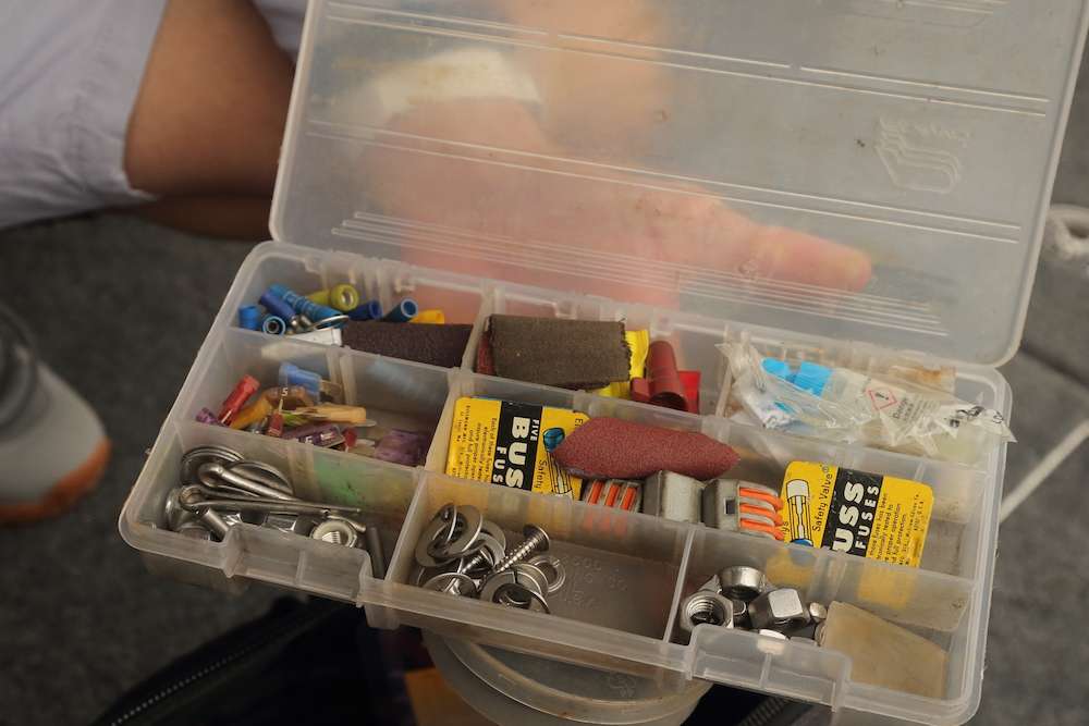 Inside the tool bag is a box holding assorted fuses, clips, nuts and bolts.