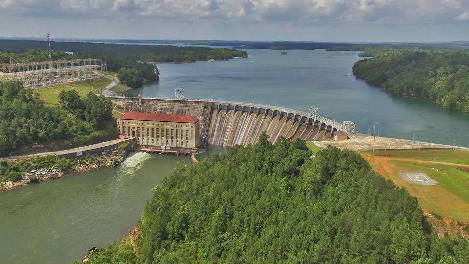 The reservoir was formed by the completion of Martin Dam in 1926, and at the time was the largest manmade lake in the country. Generating hydroelectric power for the Alabama Power Company, it was named for its president, Thomas Martin, in 1936. It was originally known as Cherokee Bluffs for a well-known rock formation near the dam.