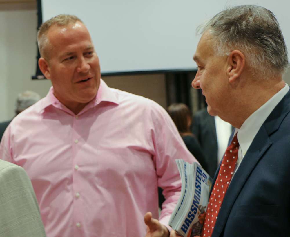 Schell and Burns speak after the meeting before heading to Green Pond to continue the tour.