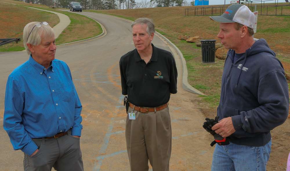 David Belk, General Contractor of the Green Pond project, Glenn Brill, and Tom Child, the installer of the dock systems, converse about the new dock system, installed before the Classic. 
