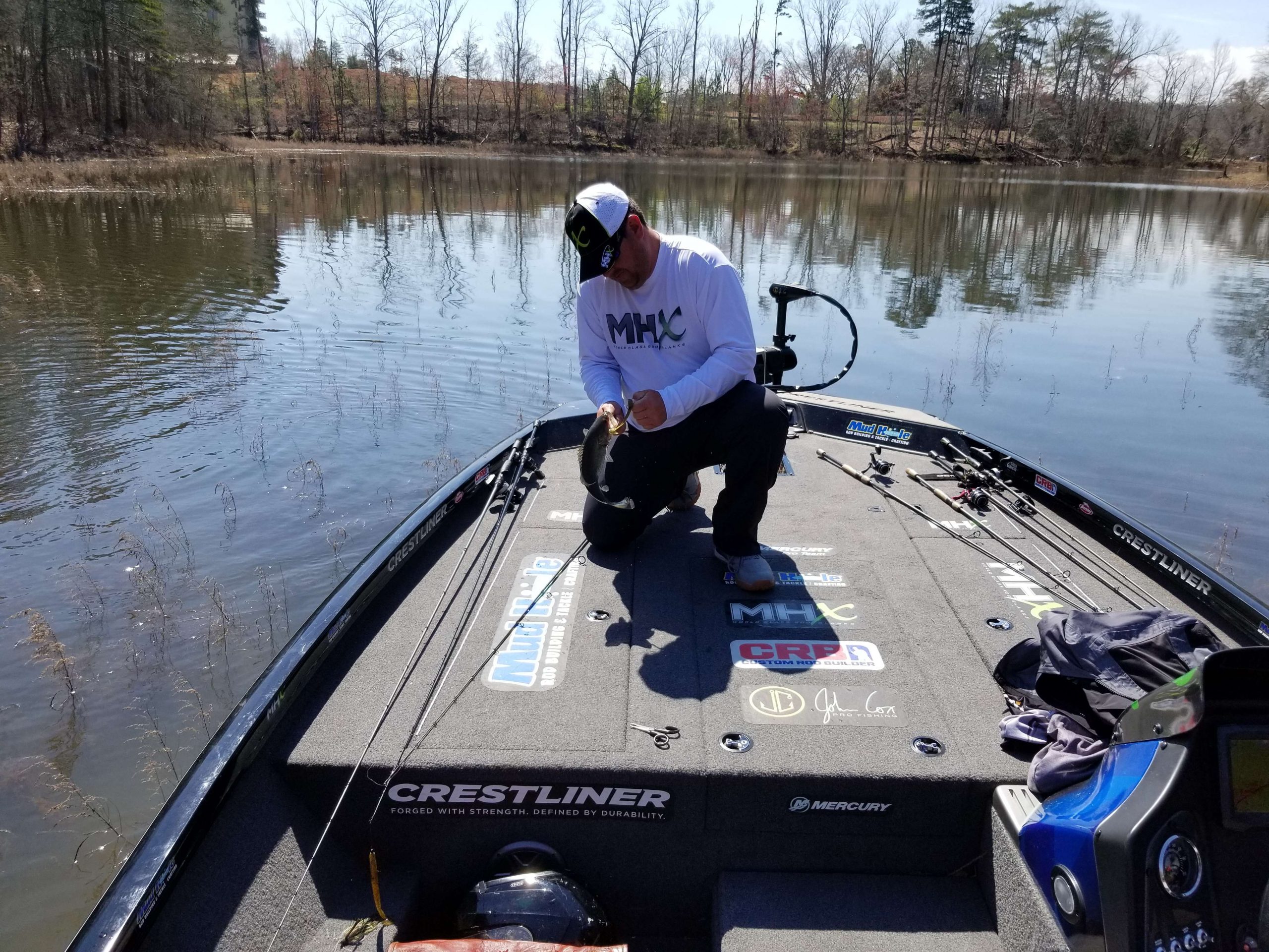 The fish are hotter, they are in the mood, and Cox is catching fish now...they are here, this should be interesting. He is playing with an 8-pounder now!
