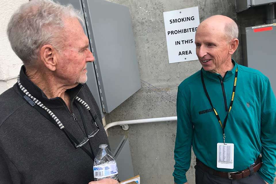 Later in the day, Jerry McKinnis (left) and Trip Weldon run into each other outside the arena loading dock. Weldon passed the two previous tournament directors at B.A.S.S., serving in that position for a record 17th Classic (2002-2018). He eclipsed Harold Sharpâs 16 Classics (1971-1986) after passing Dewey Kendrick (1987-2001) at 15 last year.