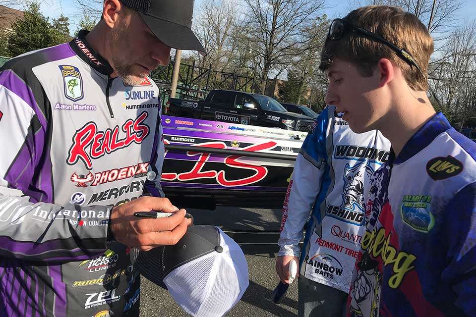 Area high school fishing teams volunteered for Classic duty, and this team was commissioned to wipe down the anglersâ boats to get them nice and shiny for the arena. Of course, getting autographs like Aaron Martens' in his downtime was also a reality. Martens finished ninth.