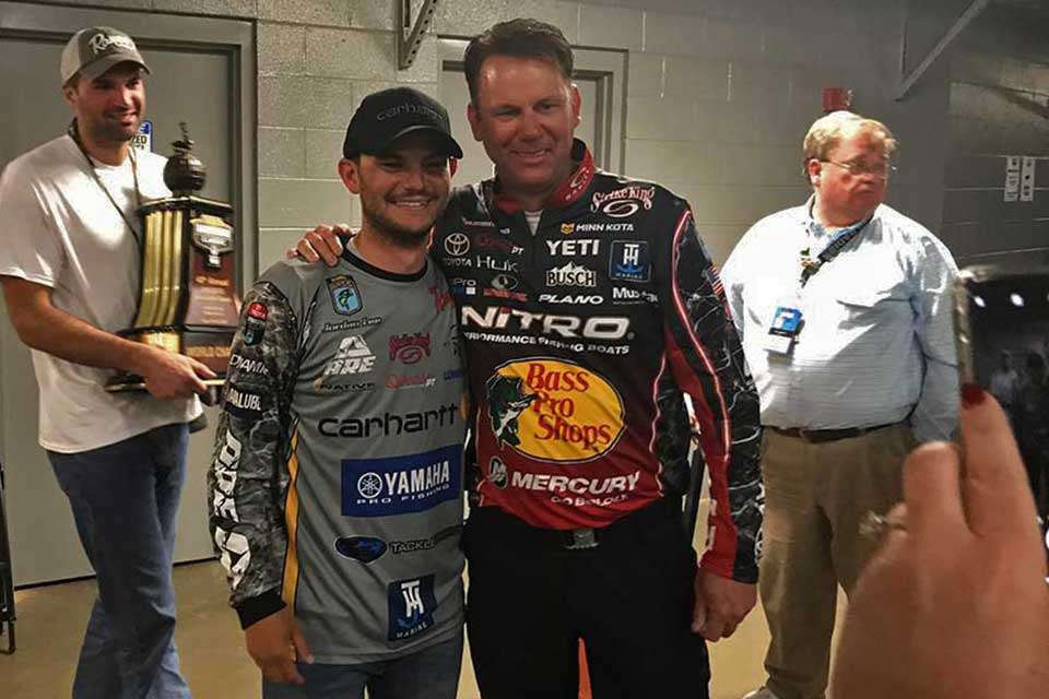 On the way to the media room, Lee is congratulated by Kevin VanDam, and they stop to pose for a quick photo. KVD, whose four Classic titles has him tied with Rick Clunn, won back-to-back titles in 2010 and 2011. Clunnâs consecutive Classic wins were in 1976 and 1977. At 26, Lee has already matched one of their feats.